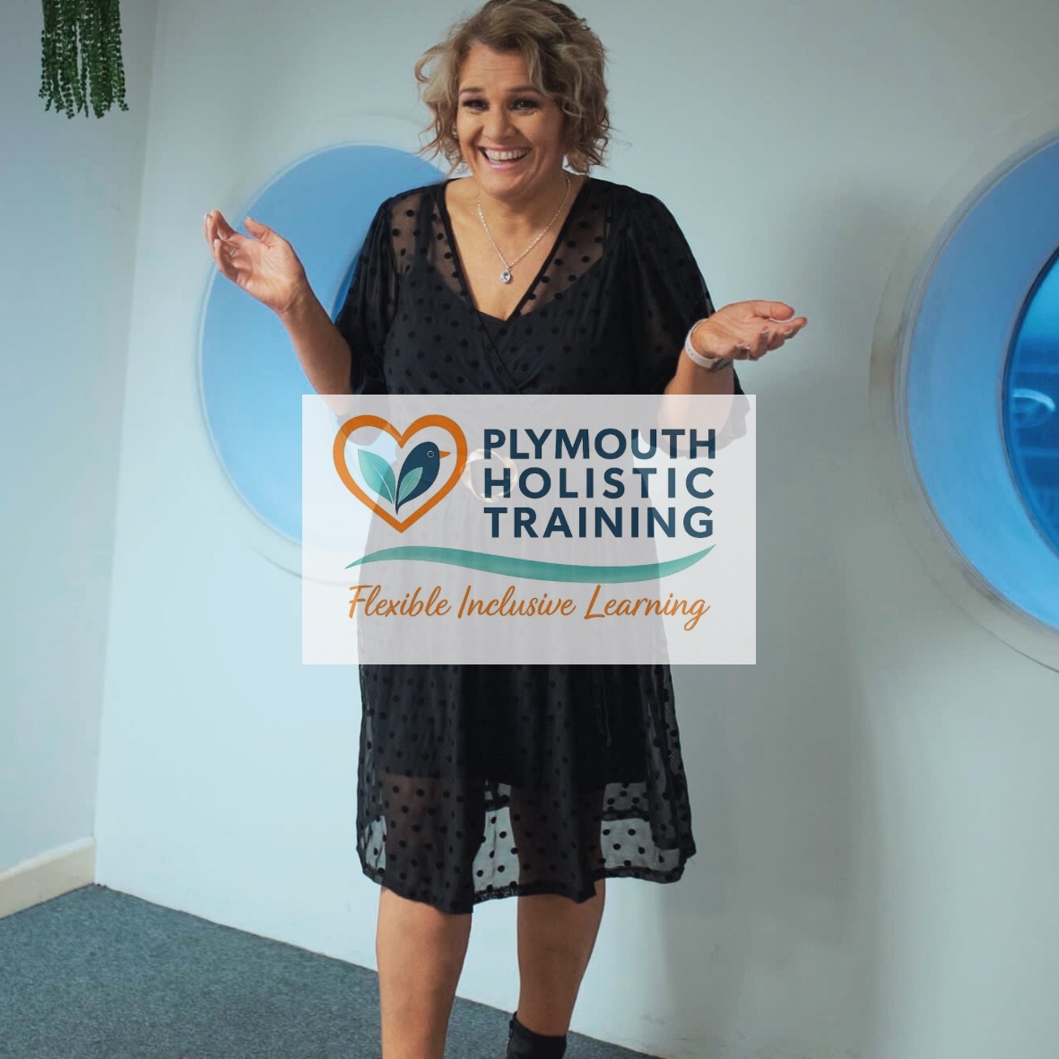 Karen, the tutor at Plymouth Holistic Training, smiling and holding up the Plymouth Holistic Training logo