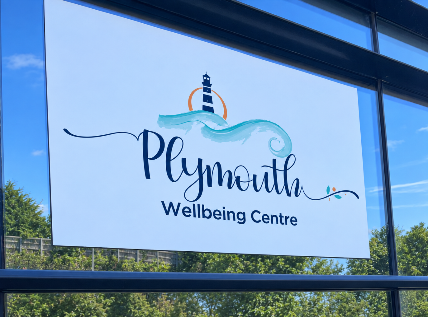 The Plymouth Wellbeing Centre sign in the window at Lynher House, Bush Park, Estover, on a sunny day