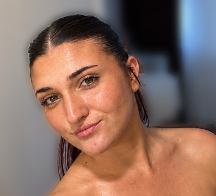 Freyja from Studio Freyja smiling, with her dark hair swept back